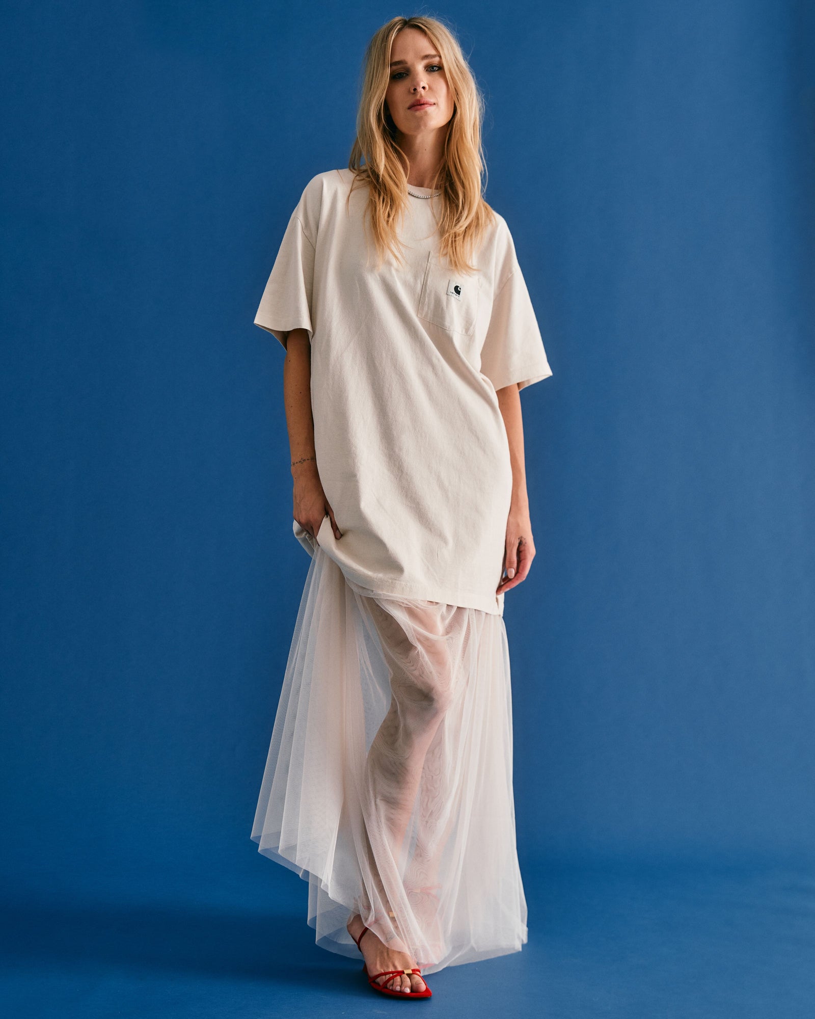 woman in white wedding dress and oversized t-shirt