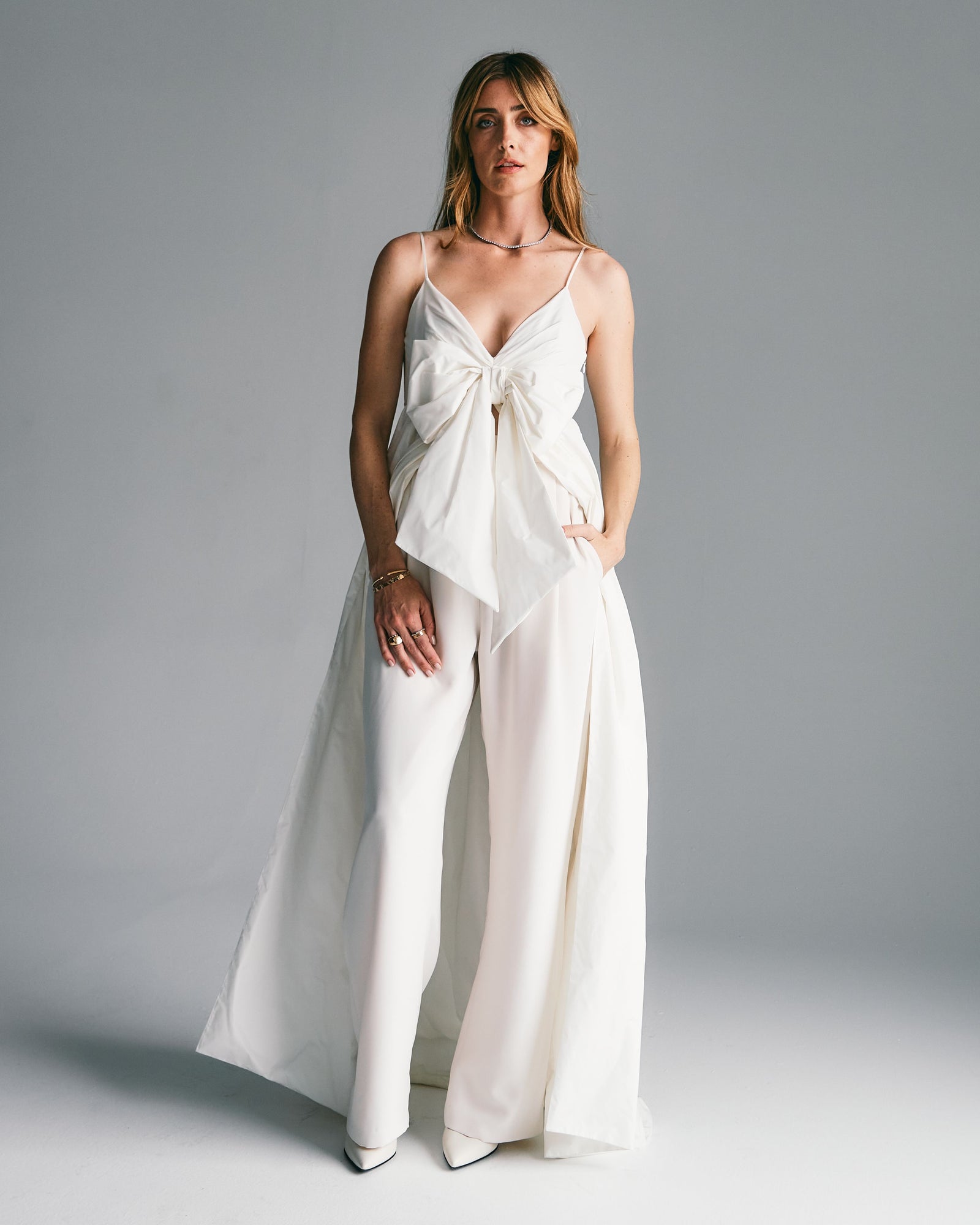 woman in white wedding dress big bow on the front