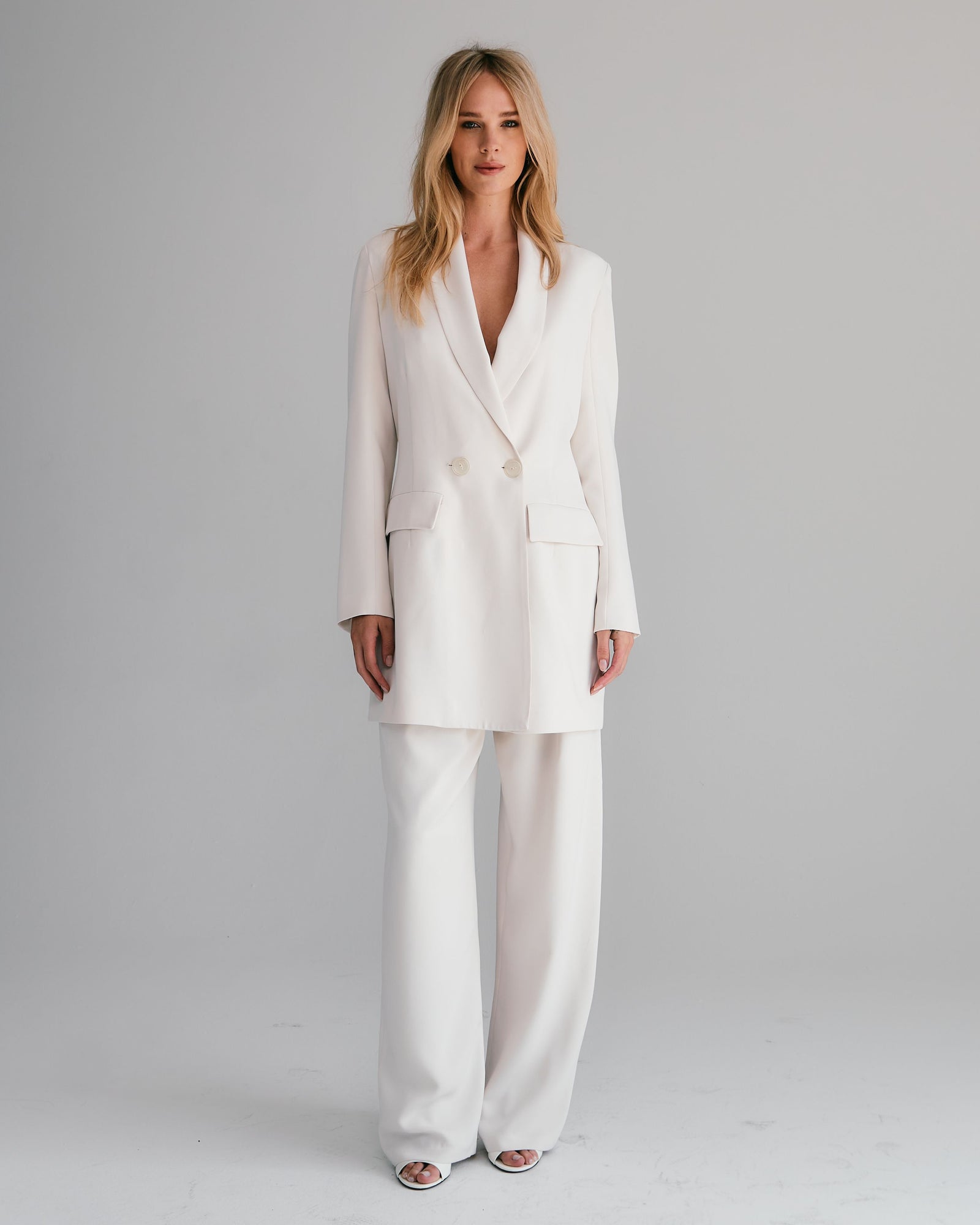 woman in white pant suit